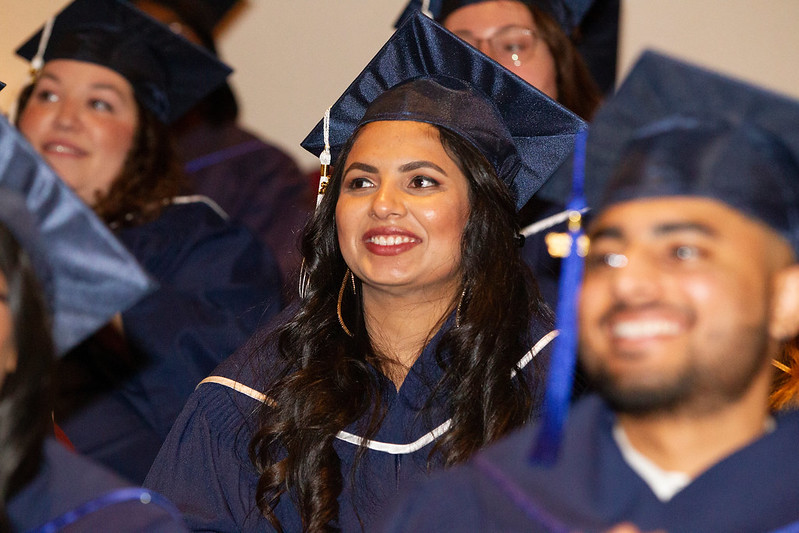 Graduate smiling at Convocation 2022