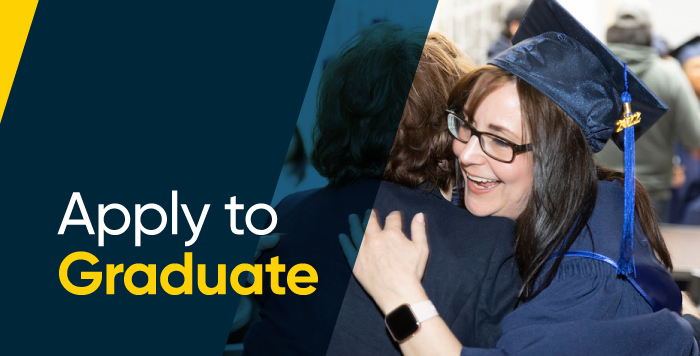 Image of graduate hugging family member