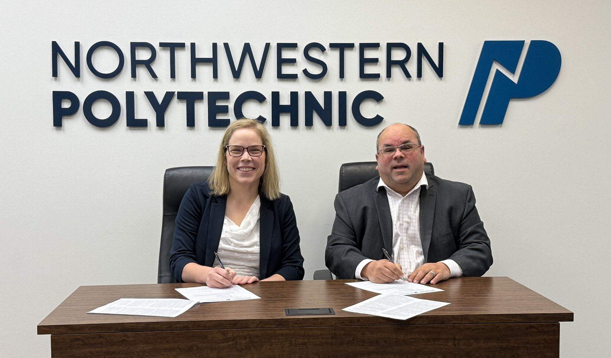 NWP President and CEO, and Mike McMann, FVSD Superintendent sat side by side after signing the MOU