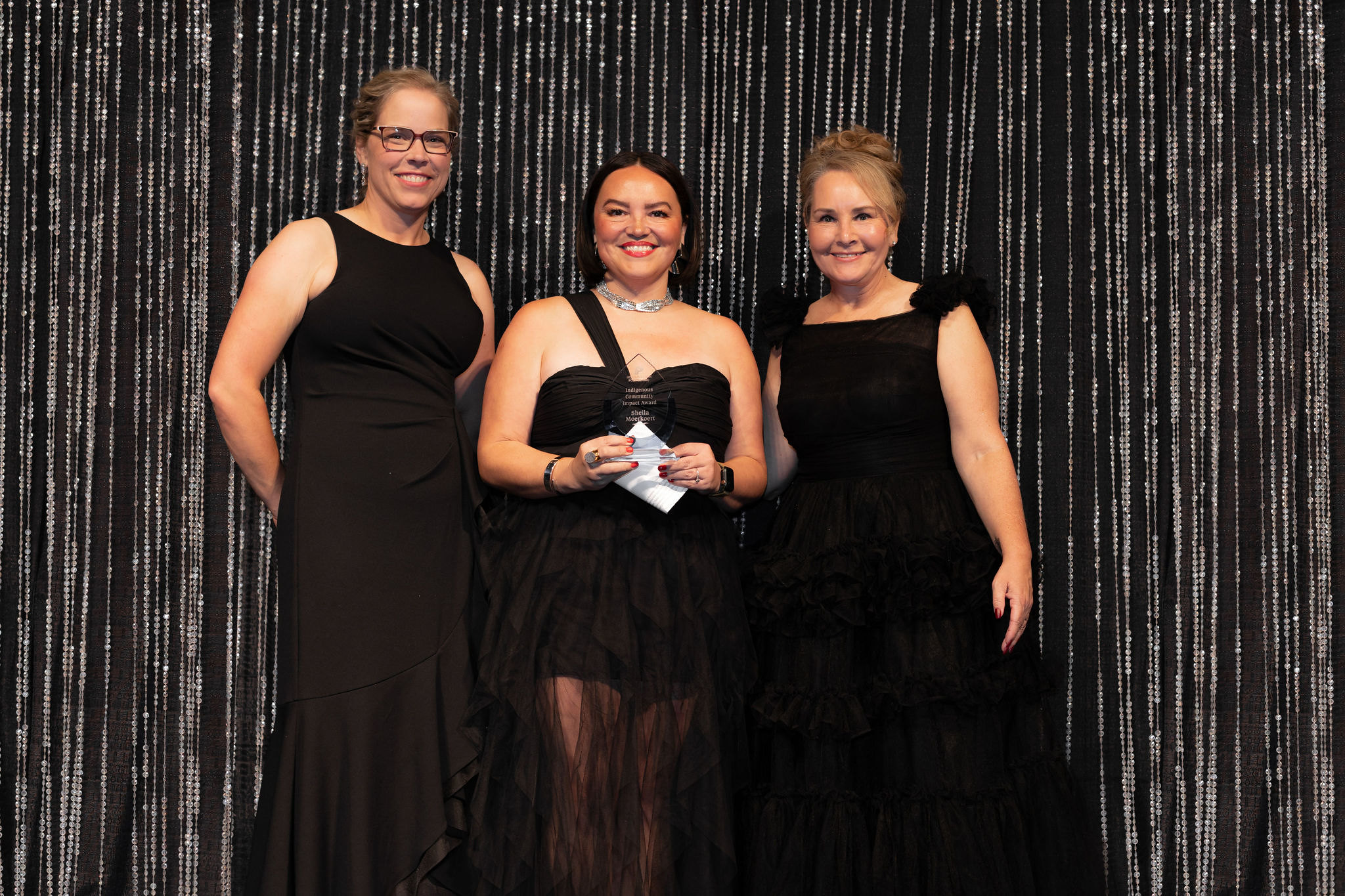 Sheila Moerkoert, Indigenous Community Impact Award Recipient flanked by NWP's Board Chair, Shawna Miller, and President and CEO, Vanessa Sheane