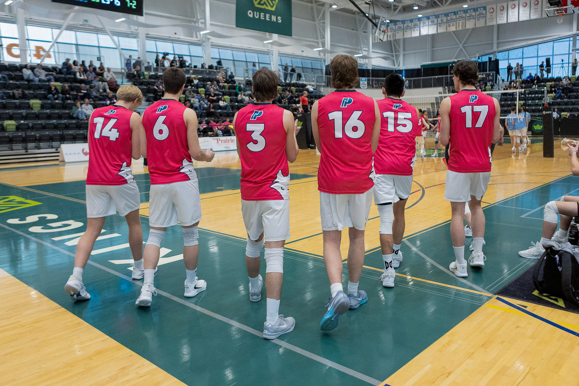 Men's volleyball squad walking onto the court at the 2025-26 ACAC Championship tournament