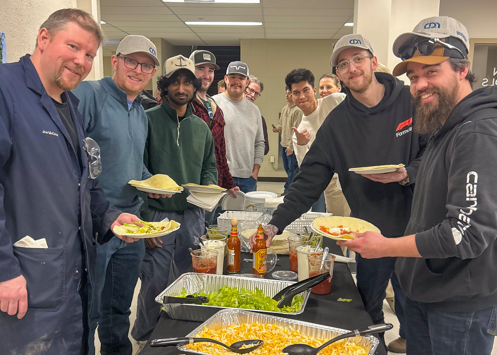 Students helping themselves to delicious looking fod at the CDN lunch