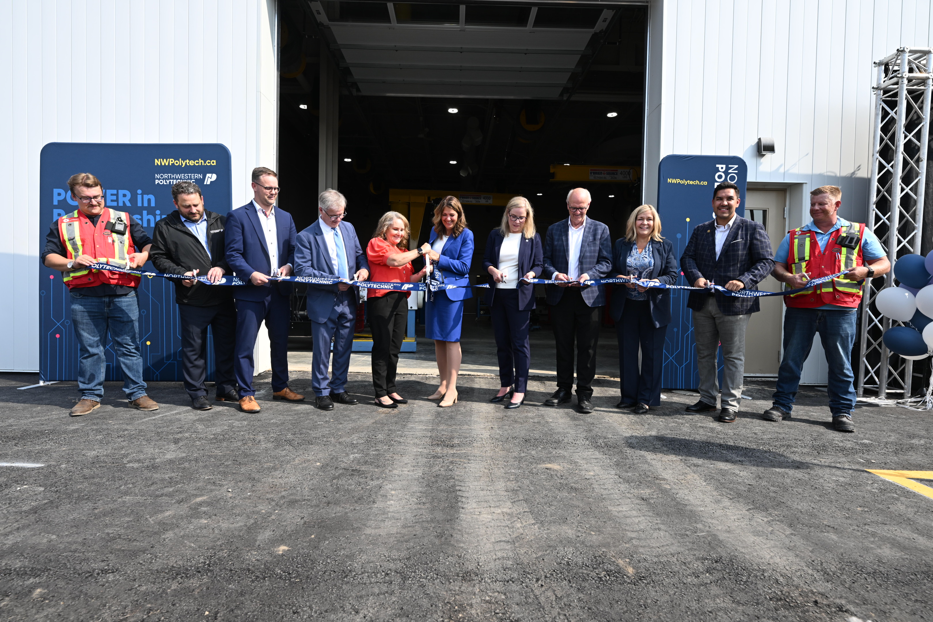 Alberta Premier, Danielle Smith, flanked by NWP Chair, Shawna Miller (L) and NWP President and CEO, Vanessa Sheane cut the ribbon to officially open the NWP Skilled Trades Training Centre (R)