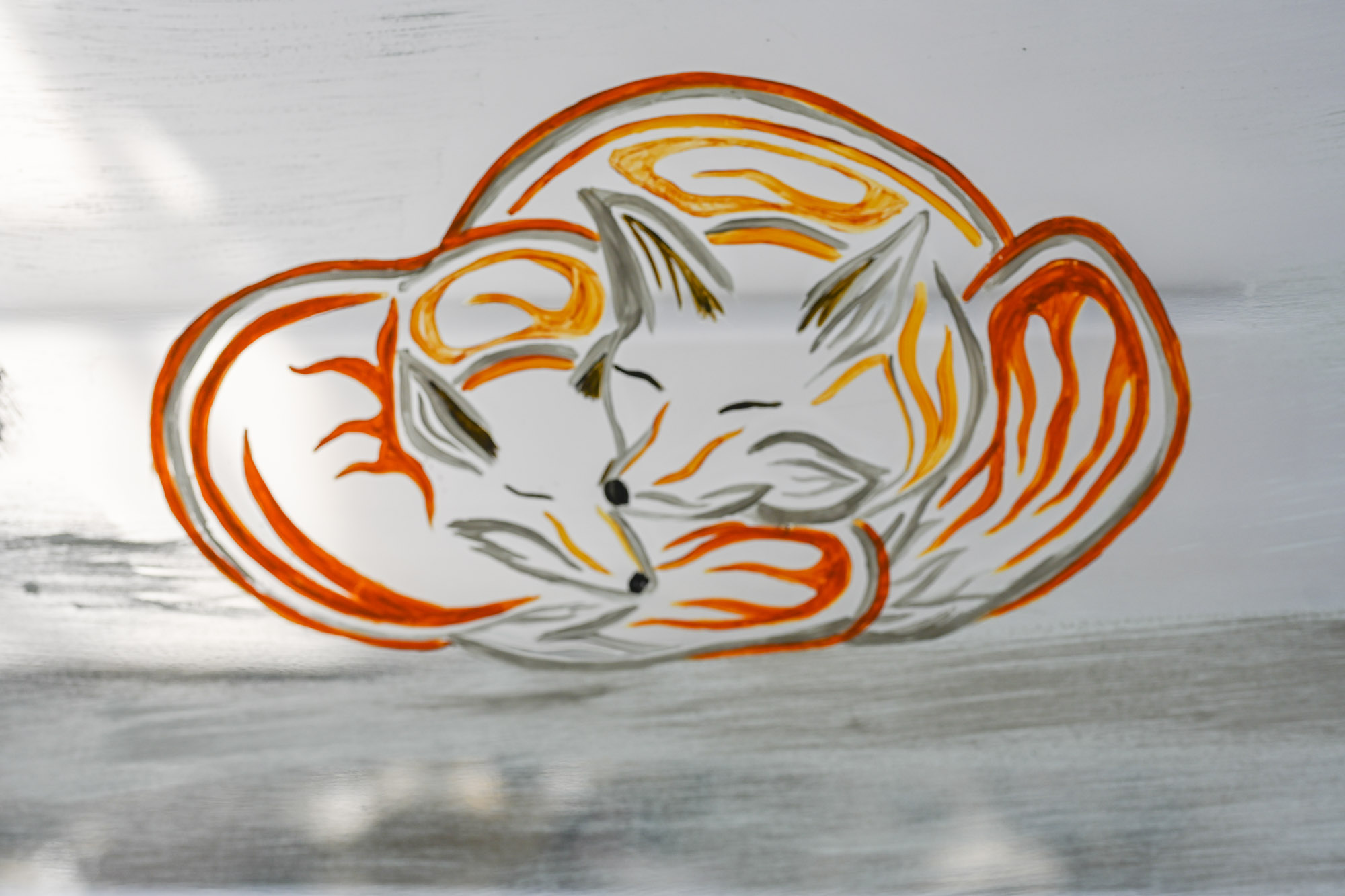 A close up of the fox and pup featured in the Indigenous winter scene mural