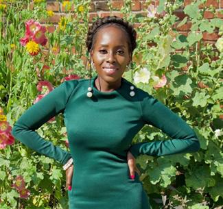 Andile Nyasha Pfupa with colourful flowers in the background