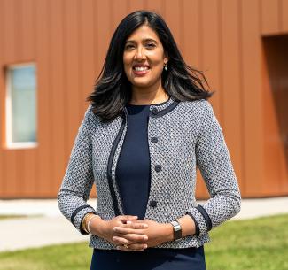 Sivagowry Lewis, Dean of Applied Research standing in front of the National Bee Diagnostic Centre in Beaverlodge, Alberta