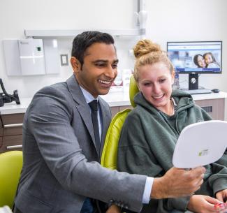 Dr Randeep Chana, NWP alumnus engaging with a happy customer in his orthodontic practice