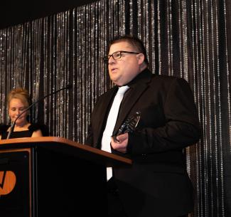 Warren Murray delivering his acceptance speech after receiving and award