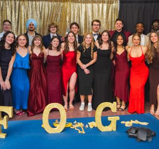 A group of smartly dressed, happy Wolves athletes posing at the 2026 Festival of Gold event 