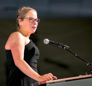 Image of Vanessa Sheane delivering her welcome address at the President's Ball