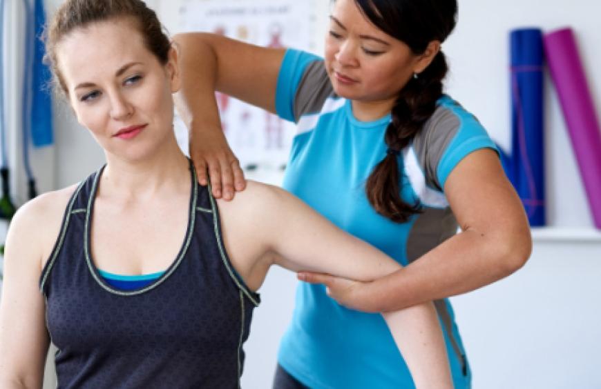 Personal trainer working with a client