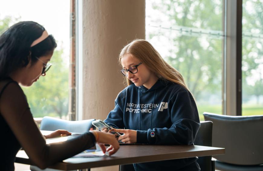Two students studying on campus