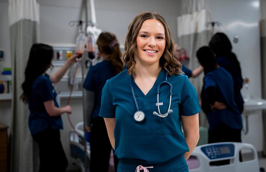 Student nurse posing in the simulation lab
