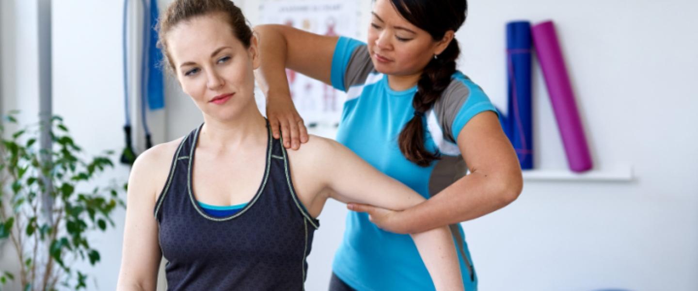 Personal trainer working with a client