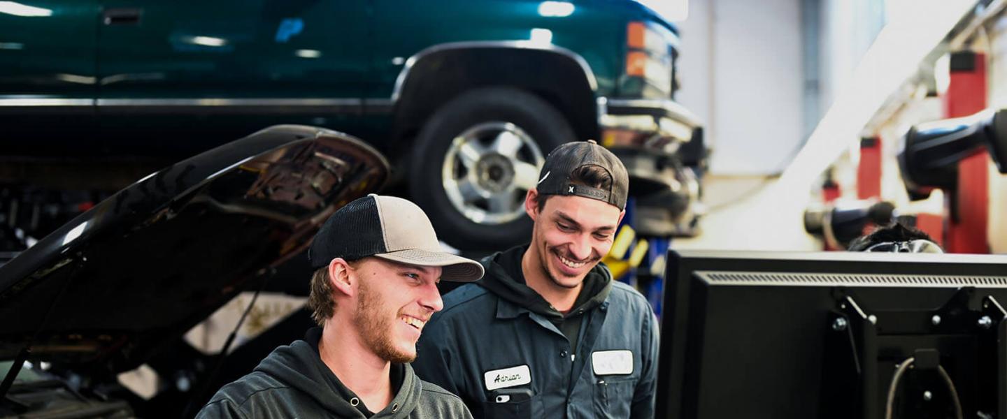 Automotive service technician students working in the workshop