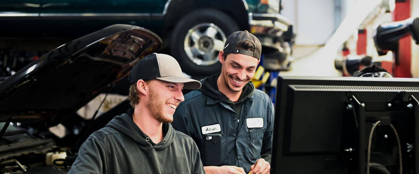 Automotive service technician students working in the workshop