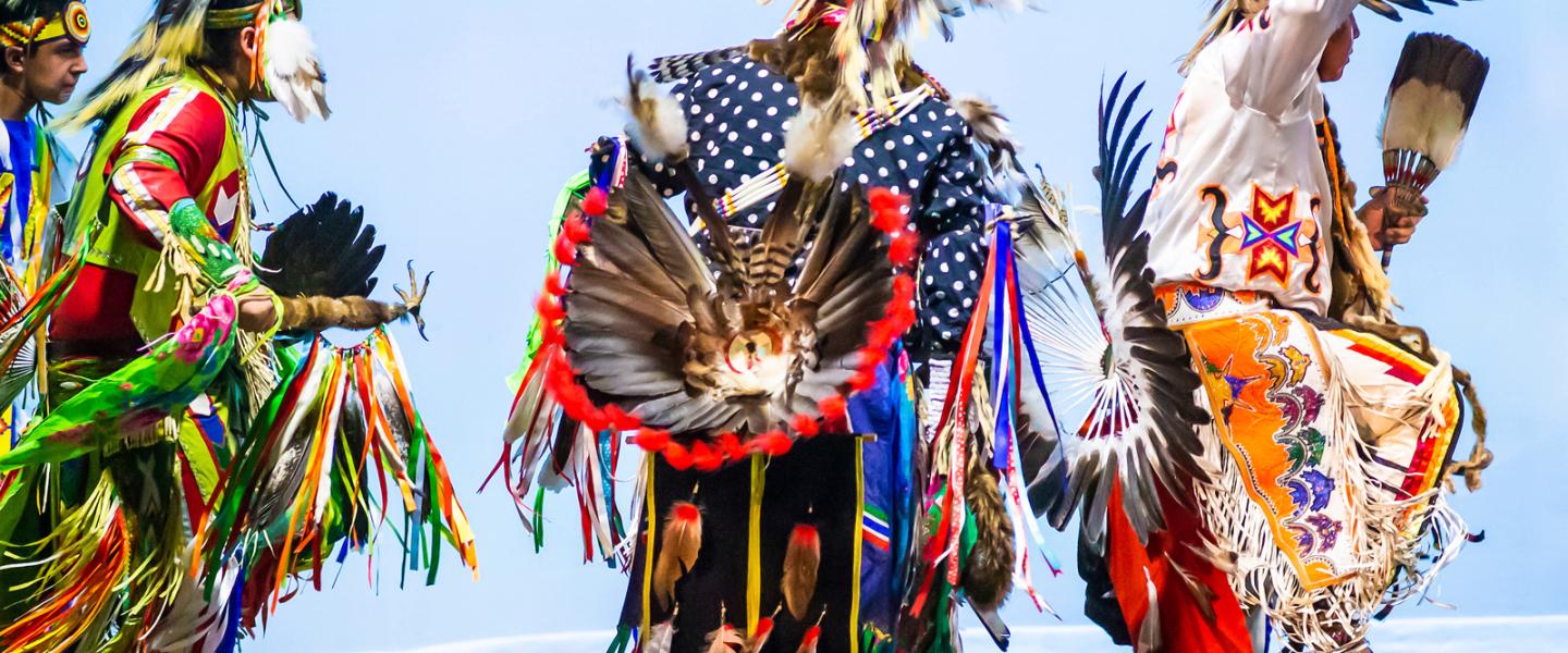Indigenous dancers wearing traditional clothing