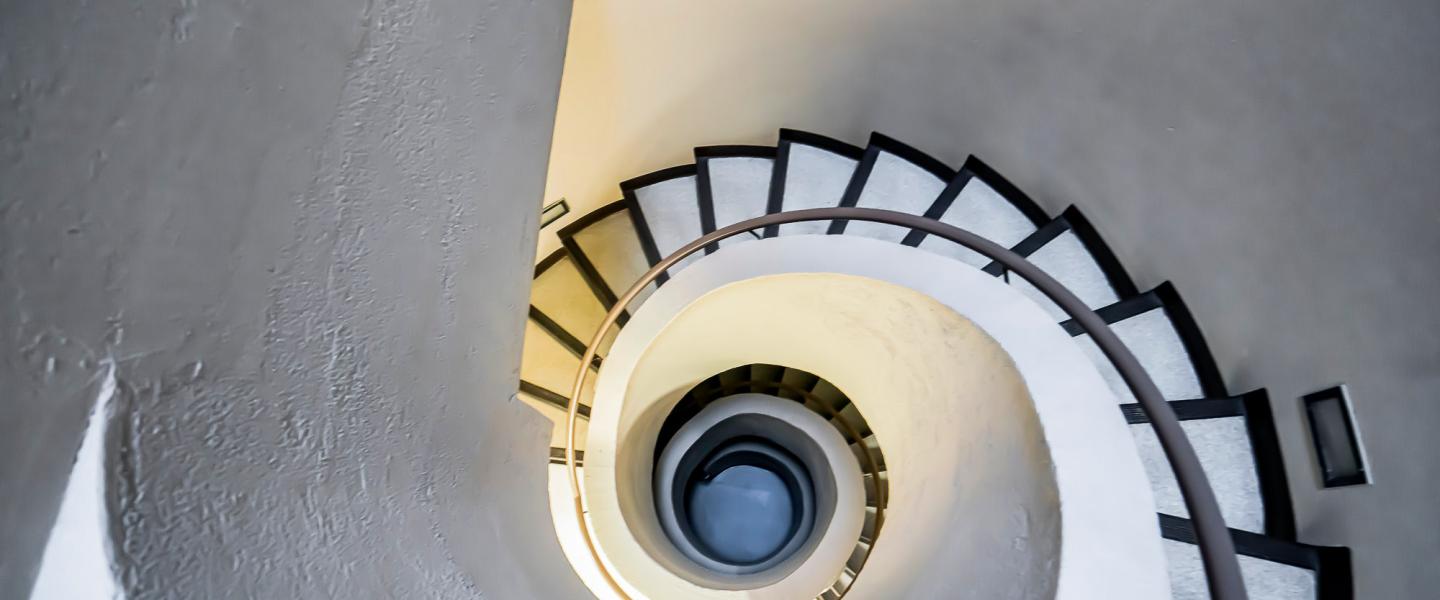 View upwards of a spiral staircase on Grande Prairie campus