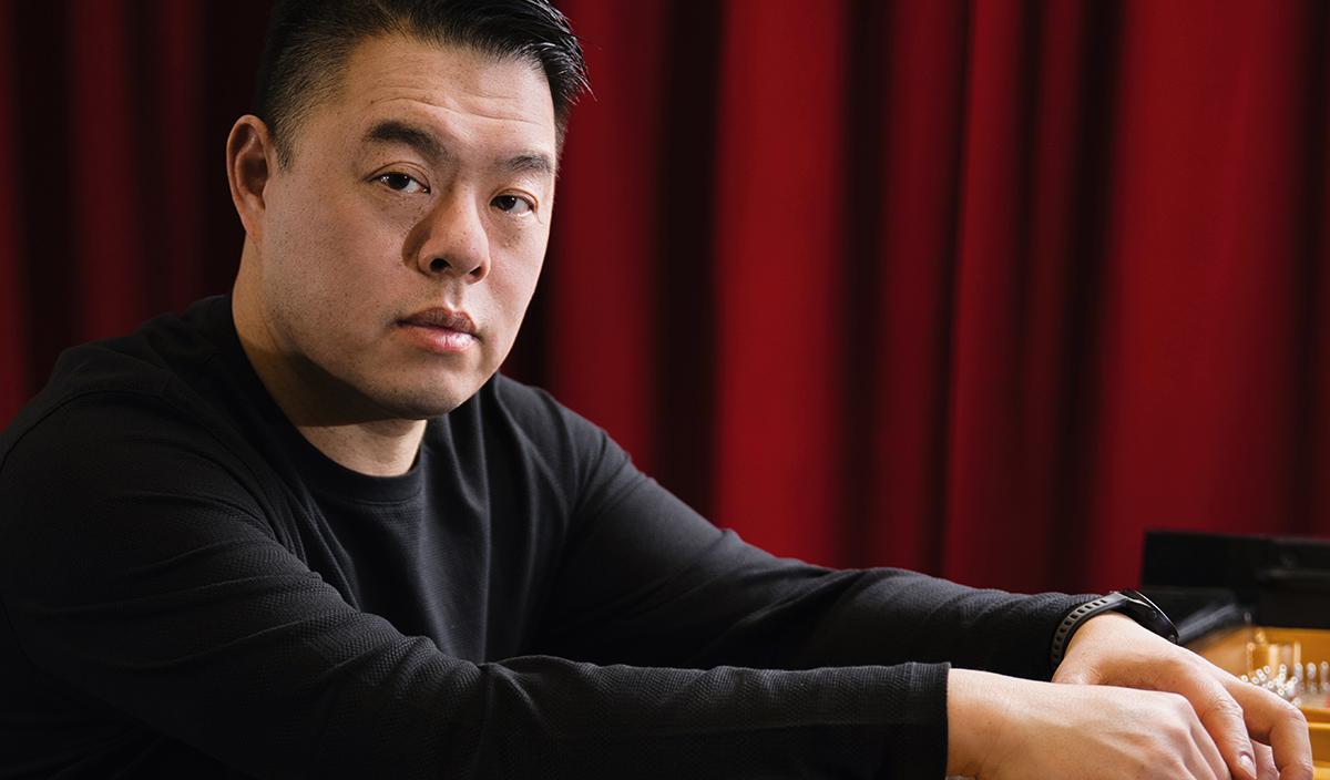 Derek Chiu, classical pianist sitting at a piano