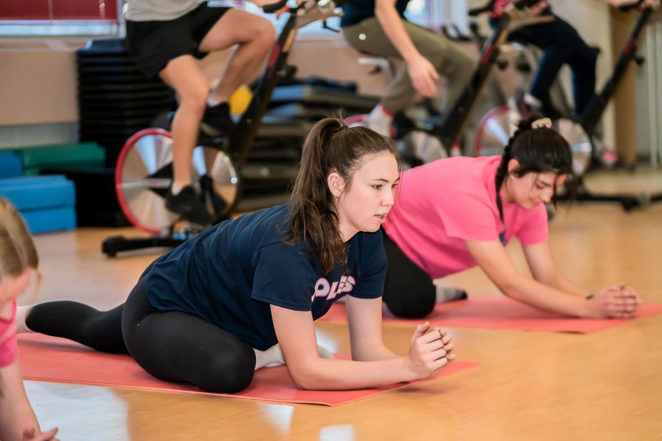 Student doing yoga in a studio