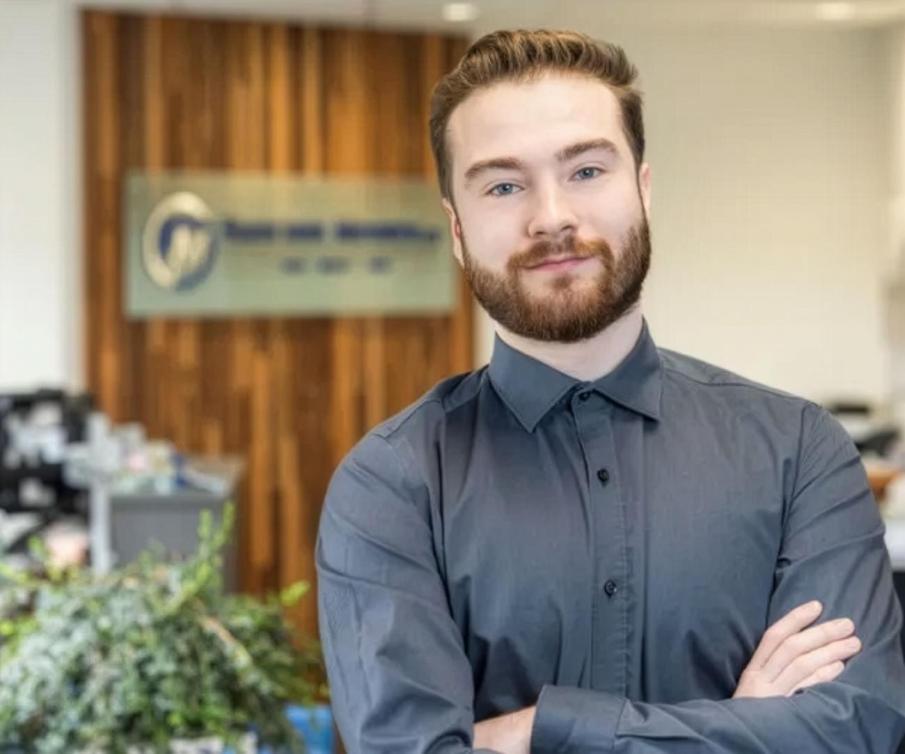Aedon Janes, NWP alumni in an office setting