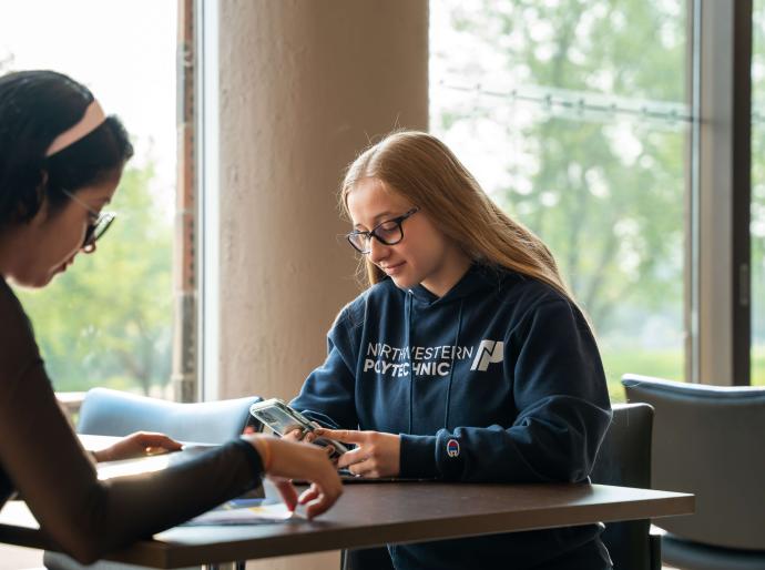 Two students studying on campus