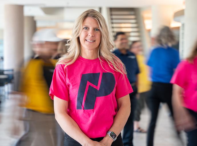 NWP staff member standing in a hero pose
