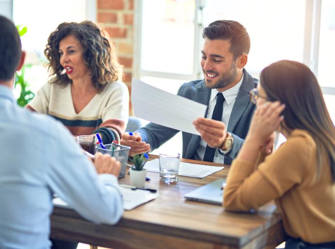 Business team working around a boardroom table