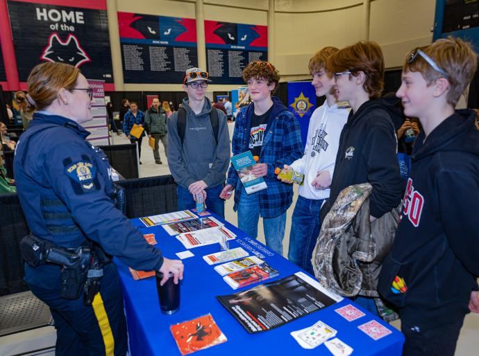 Several attendees talking to a vendor at the NWP Career Fair