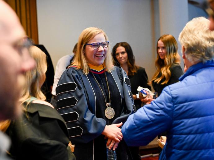 NWP's President and CEO shares a laugh with a guest after her installation ceremony