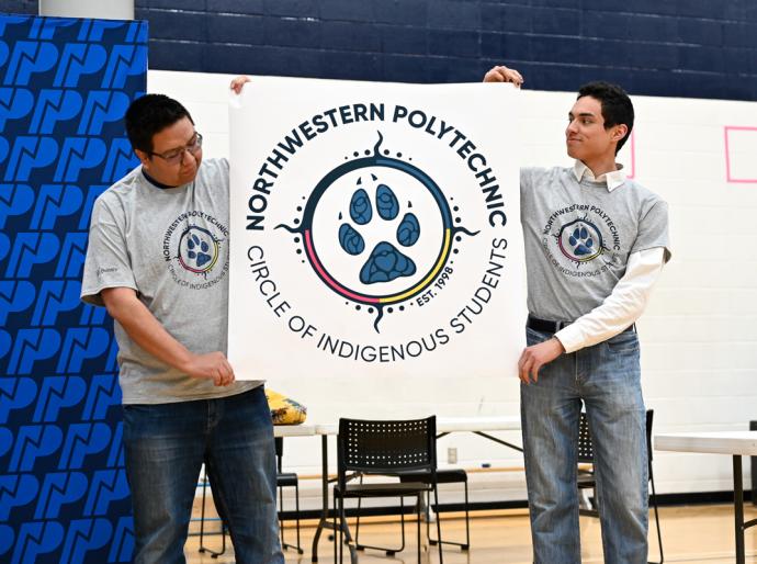 Members of the Circle of Indigenous Students unveiling the group's new logo