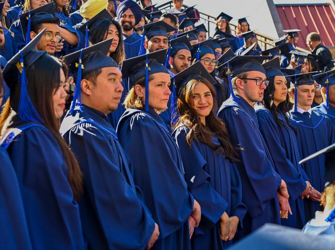 A group graduates smiling