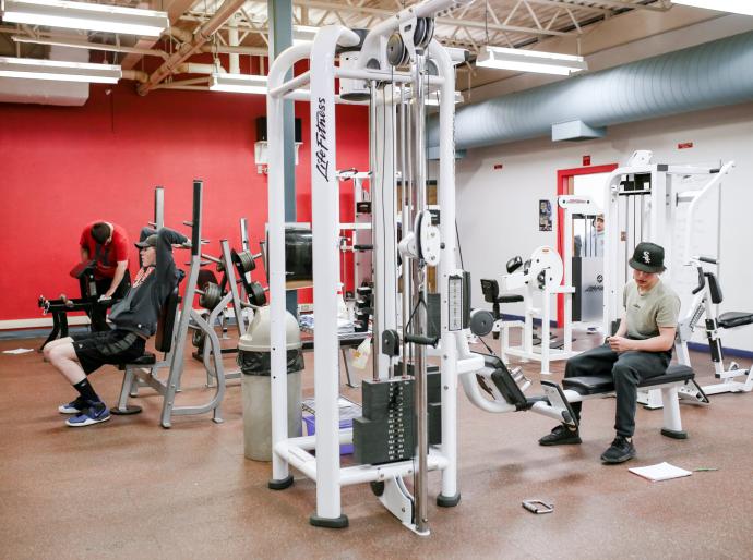 Inside the Fairview fitness centre weight room featuring equipment and weights