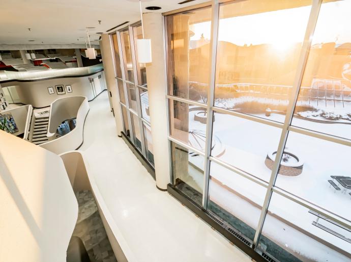 Sunshine pouring through the large windows along the courtyard at Grande Prairie Campus in the morning