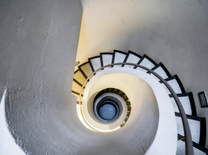 View upwards of a spiral staircase on Grande Prairie campus