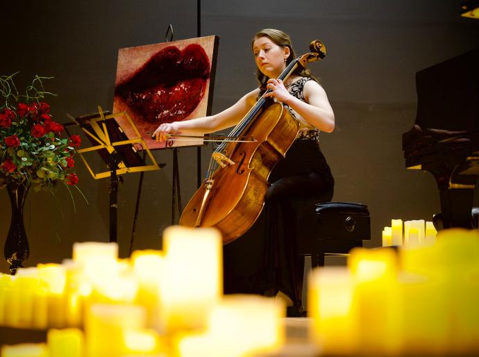 Cellist Katherine Pernal playing cello onstage at the springtime sonata concert