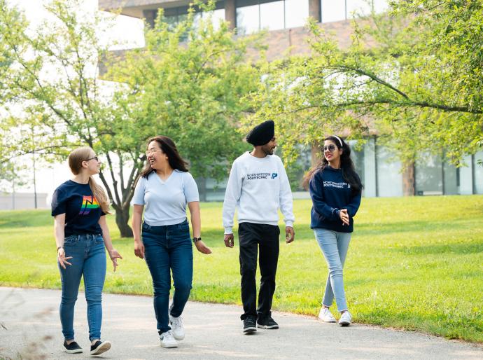 Students walking and chatting on a summers day on Grande Prairie Campus