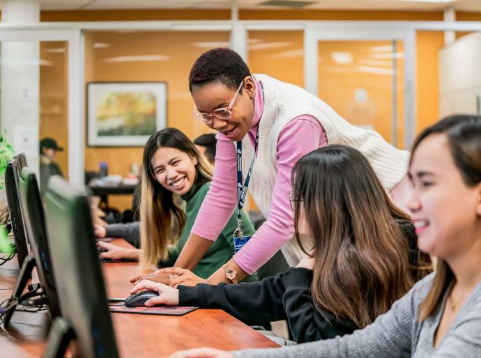Students receiving help from a learning assistant in the Learning Commons