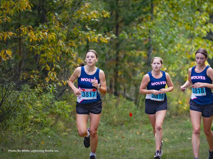 Cross country runners on the Wapiti Nordic Trail