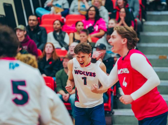 Wolves men's volleyball player celebrating after winning a point