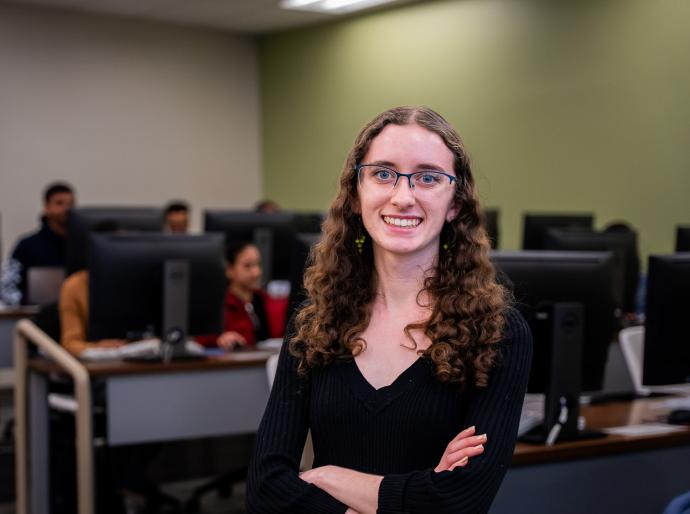 Happy student posing in the computer lab