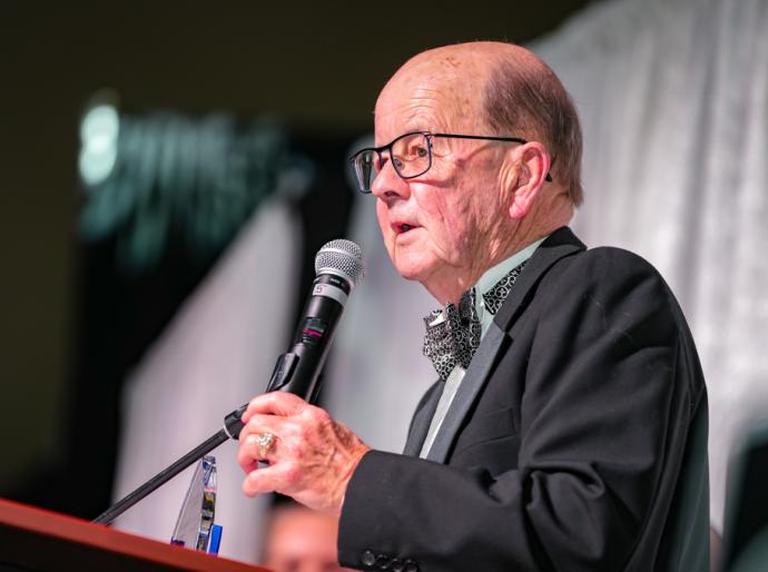 Community Alumni Award recipient, Fred Estlin at the microphone.