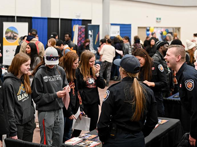 Vendors happily interacting with students at the 2024 Career Fair