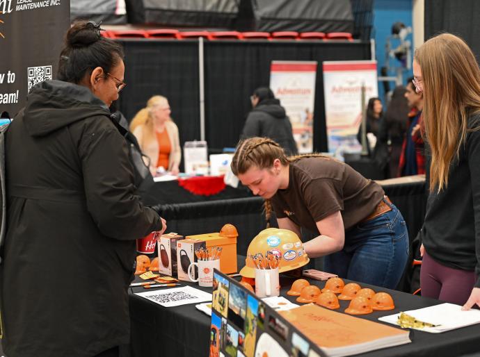 Vendors happily interacting with students at the Career Fair