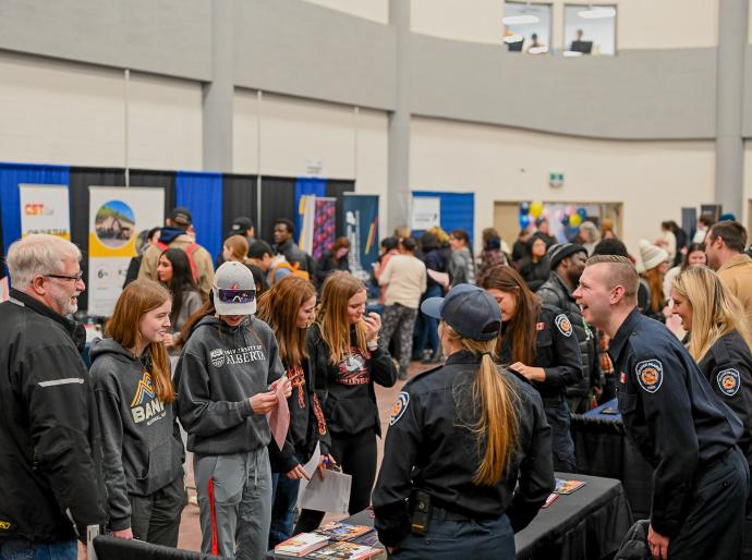 Vendors happily interacting with students at the 2024 Career Fair