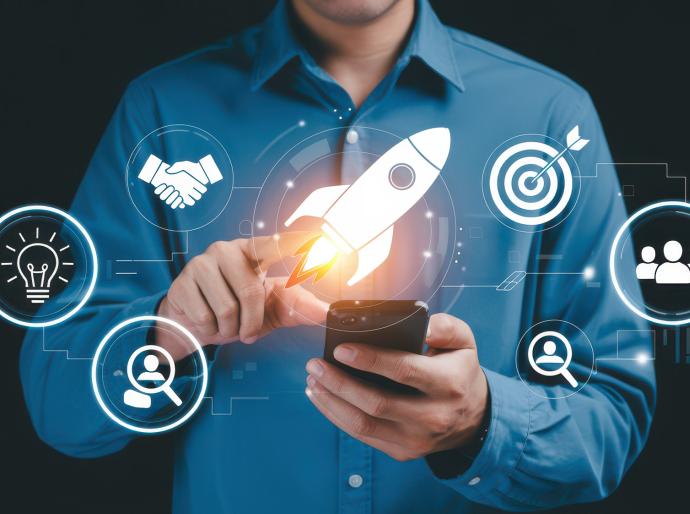 Businessman launching digital innovation with rocket and strategy icons.