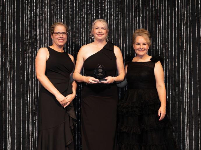 Kim Gravengard, Alumni Leadership Award Recipient flanked by NWP's Board Chair, Shawna Miller, and President and CEO, Vanessa Sheane