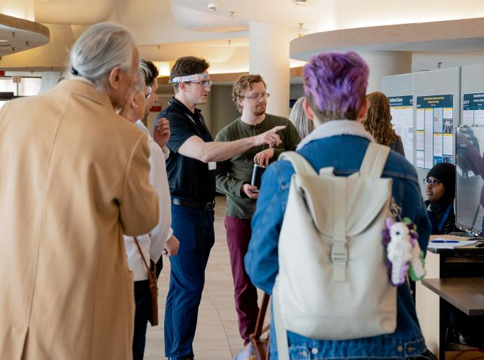 Student presenting his research at a student research conference