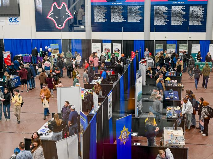 An aerial shot of exibitor booths set up in the main gymnasium