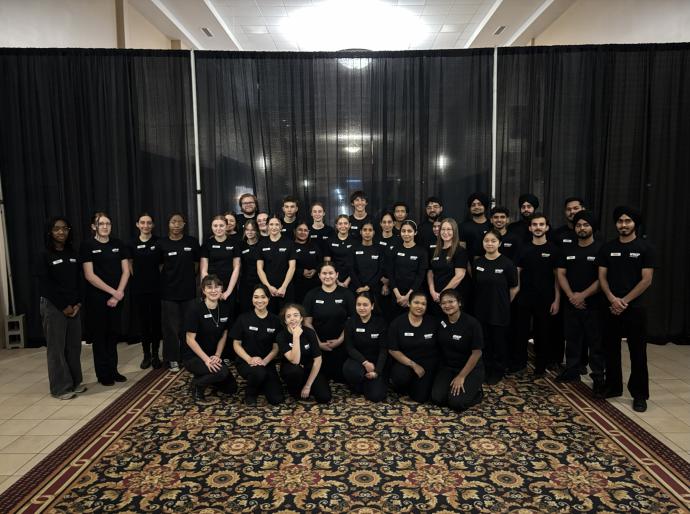 Volunteers pose in a group at the 2025 Presidents Ball